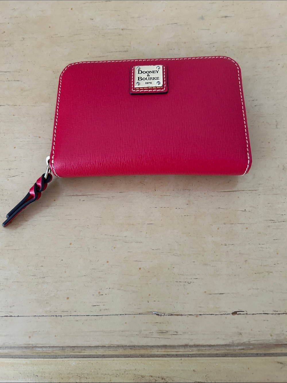 Dooney & Bourke 1975 Wexford  medium leather zip around red wallet